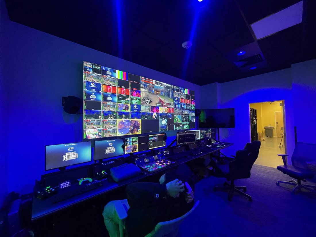 Broadcast control room with a wall of monitors